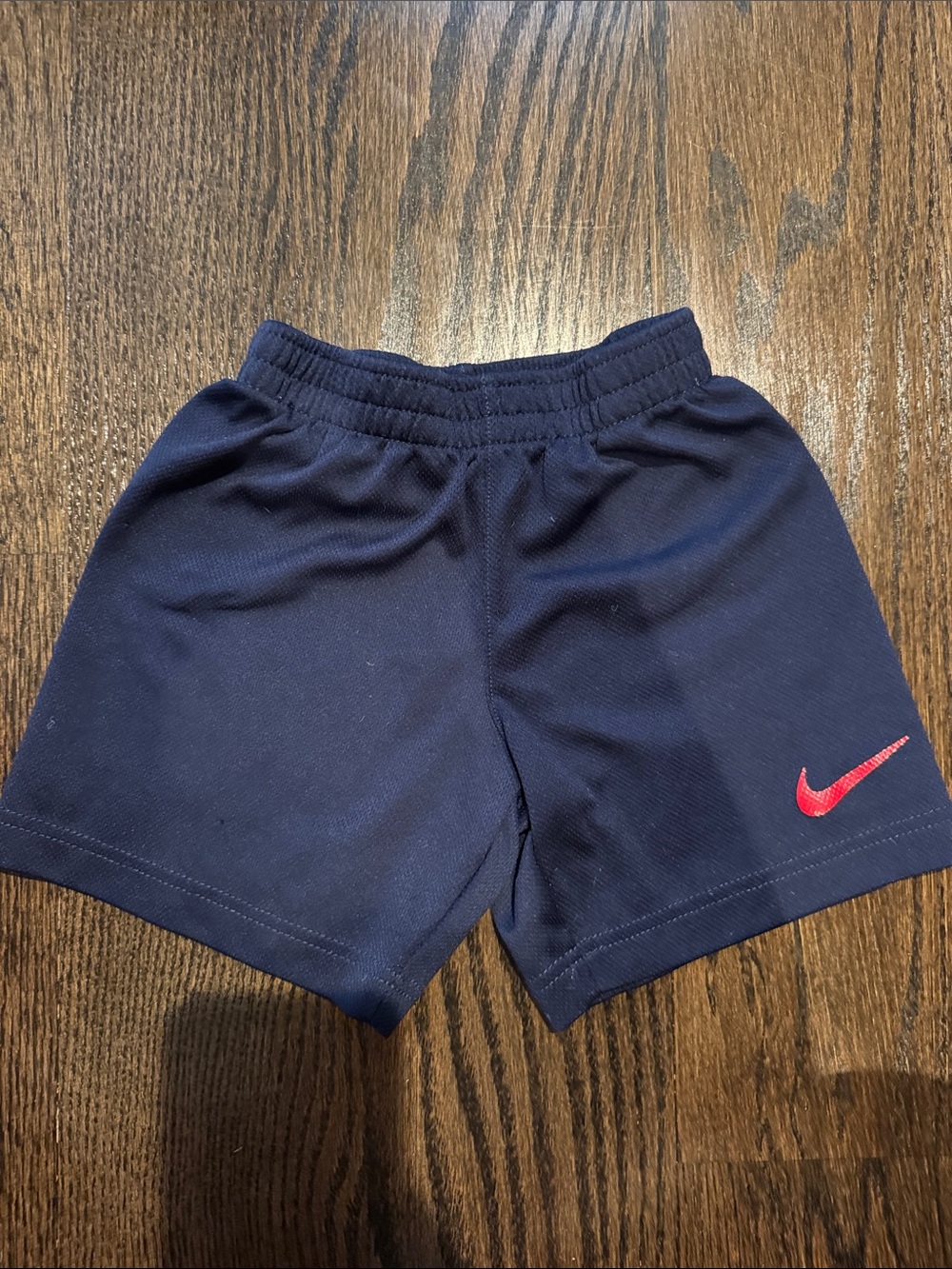 Nike Navy Kids Athletic Shorts with Red Swoosh